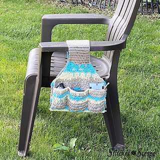 a bag meant to hung over the arm of a wheelchair or patio chair